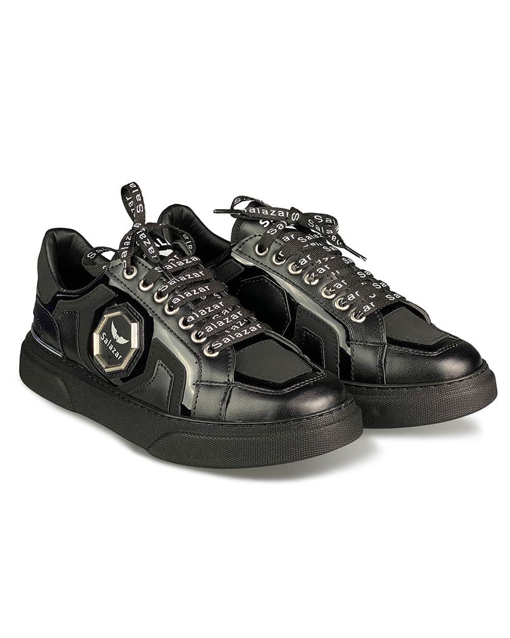 Trendy black sneakers with laces with white writing and metal badge and black sole for men