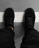 BB Salazar men's black leather-look low-top sneakers with trendy studs