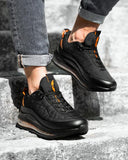 Trendy black sneakers shoes with gold air bubble effect soles for men