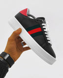 Trendy black sneaker shoes with red green stripes and thick sole for men