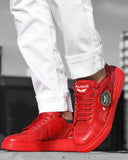 Trendy red sneakers with laces with writing and metal badge and red sole for men