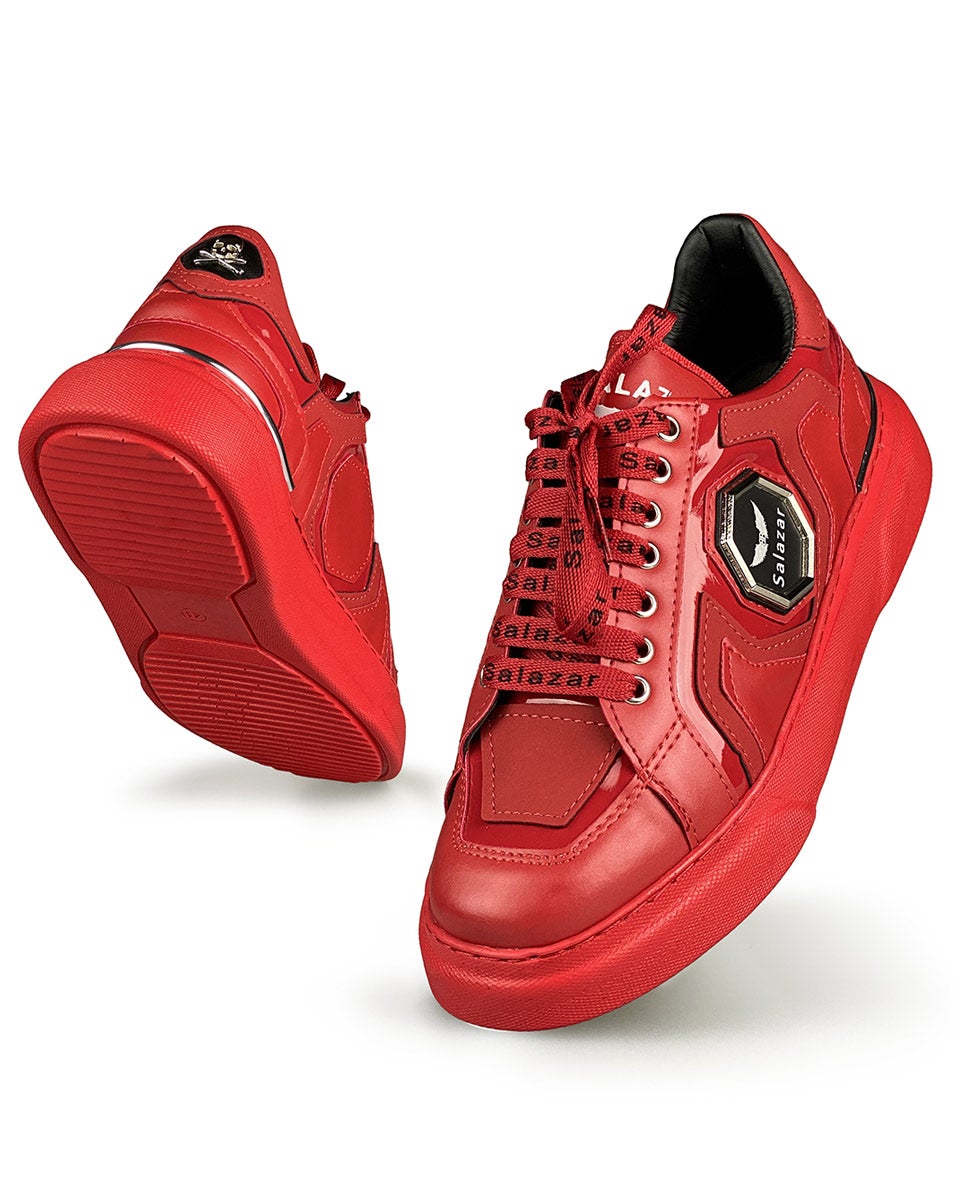 Trendy red sneakers with laces with writing and metal badge and red sole for men
