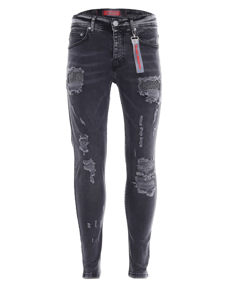 Distressed faded black slim jeans with holes and icon rhinestones for men