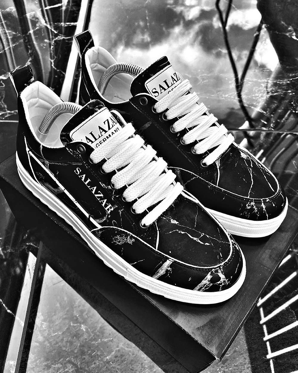 Black sneakers with trendy marble patterns for men